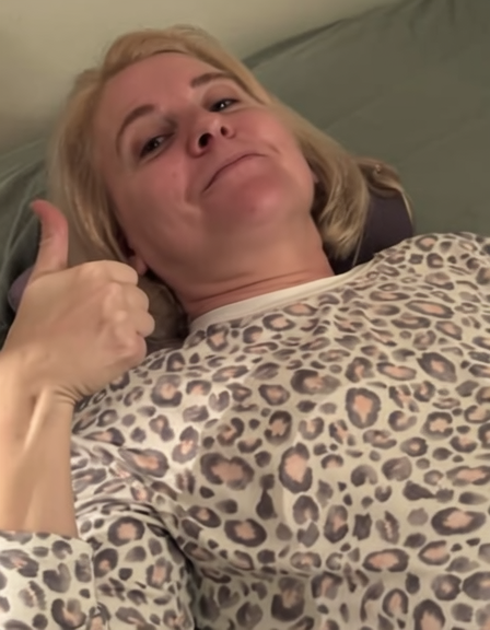Monica giving a thumbs-up while using her pillow